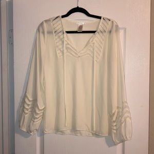 Off white long sleeve top.